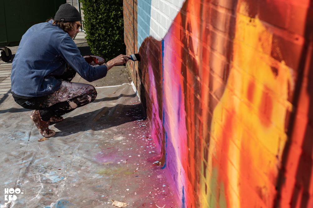 Artist David Walker painting his mural In Ostend, Belgium