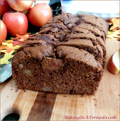 Caramel Topped Apple Spice Bread, a quick bread filled with fall flavors, chopped apples and spices. Topped with caramel filled chocolates | Recipe developed by www.BakingInATornado.com | #recipe #bake
