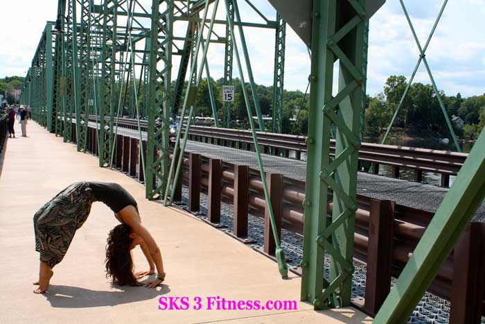 Yoga Girl doing Chakrasana Steps - How to do Wheel Pose on foot path near bridge