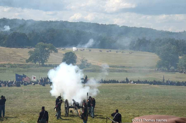 Gettysburg, reenactment of battle of 1863, cannon being fired.