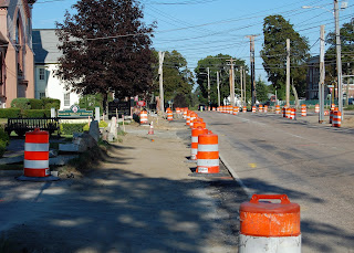 sidewalk work along West Central in front of the Historical Museum
