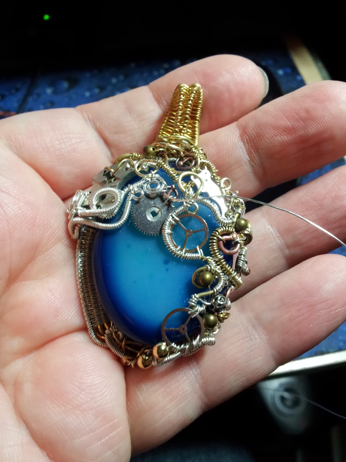 the evolution of an ornate steampunk pendant