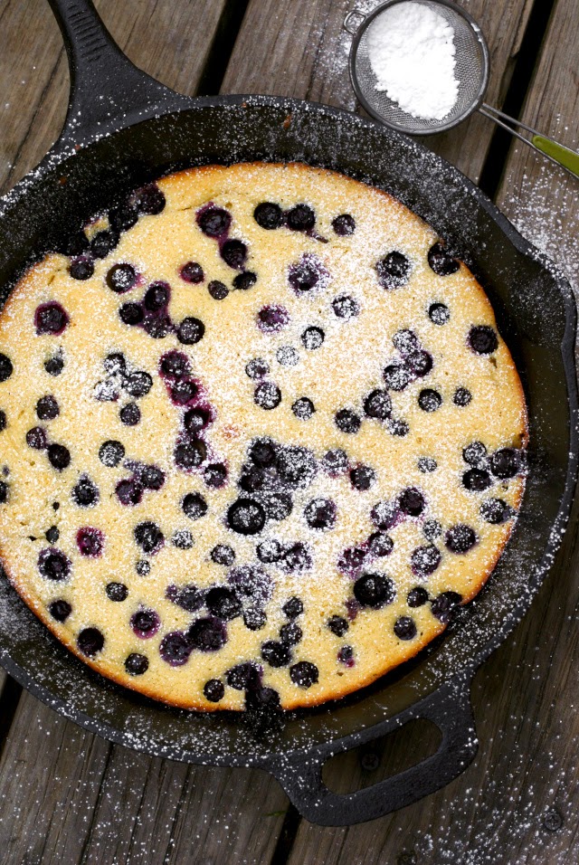 This Oven-Baked Blueberry Pancake made from scratch is full of fresh blueberries and has a dusting of sweet powdered sugar.
