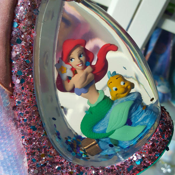 Irregular Choice Make A Splash Ariel Flounder heel close up of heel of shoe with water, glitter, ariel mermaid and flounder figures inside