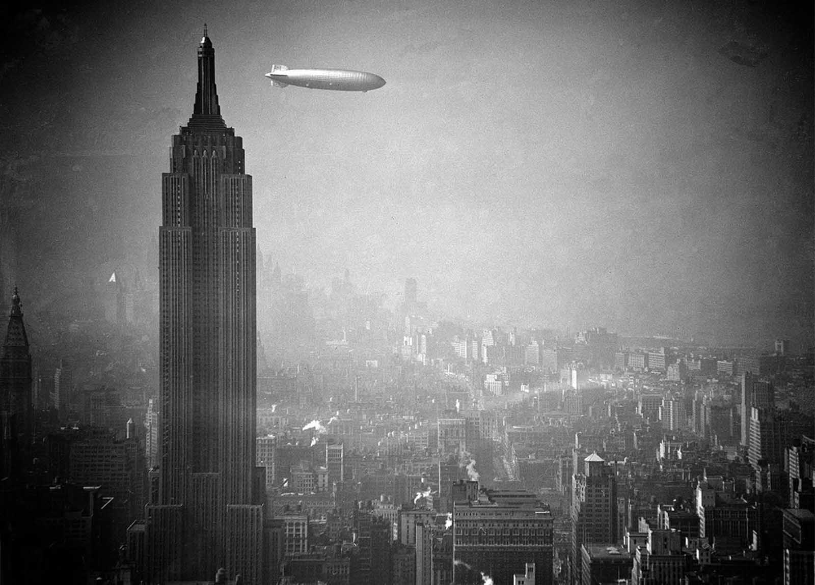 The German zeppelin Hindenburg floats past the Empire State Building over Manhattan, on August 8, 1936, en route to Lakehurst, New Jersey, from Germany.