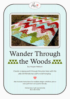 A quilt pattern cover featuring a picture of a tree quilt with a zigzag effect and the title Wander Through The Woods