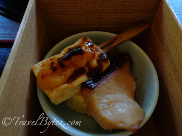 3rd box: a piece of grilled tofu (I think) sauntered with a lovely sauce and pieces of fish.
