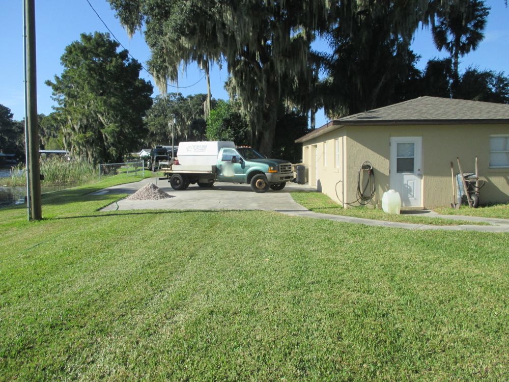 Mike and Lisa's World Spraying The Spanish Moss