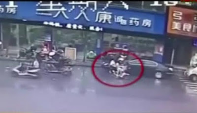 c Five ladies spotted riding one tiny bike in China