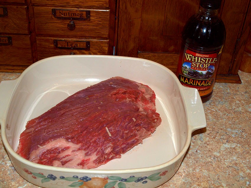 Pellet Smoker Cooking Grilled Flank Steak, veggies and couscous