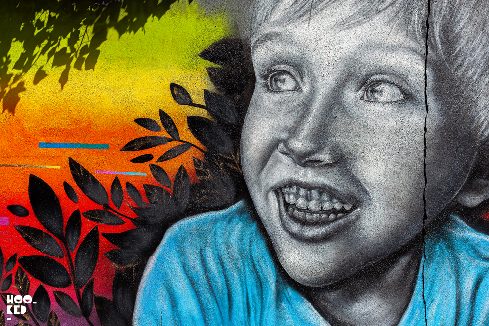 Waterford street art festival, smiling boy mural by Irish artist Caoilfhionn Hanton