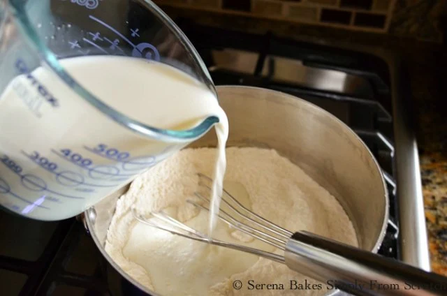 Whisk milk into flour sugar mixture to make Coconut Pudding.