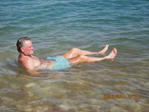 Freestyle World Traveler in 'seated float' position due to high salinity in Dead Sea, Israel