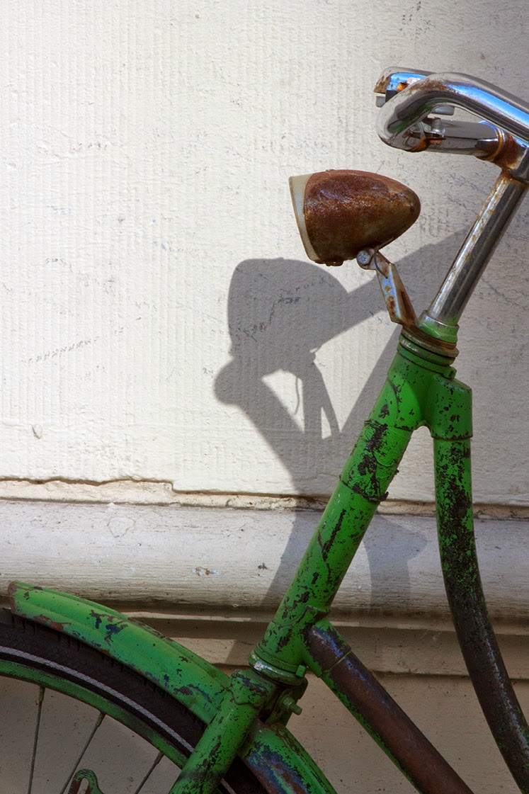 shadow of green bicycle