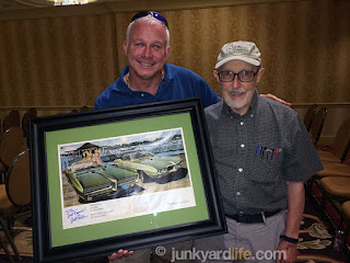 Bill Porter poses with Ron Kidd and his Bill Porter signed 1968 Pontiac GTO adverstisement.