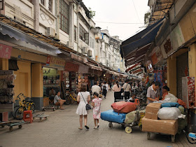 woman and girl walking down Gaodi Street in Guangzhou