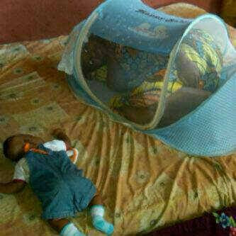 baby sleeps on the bed