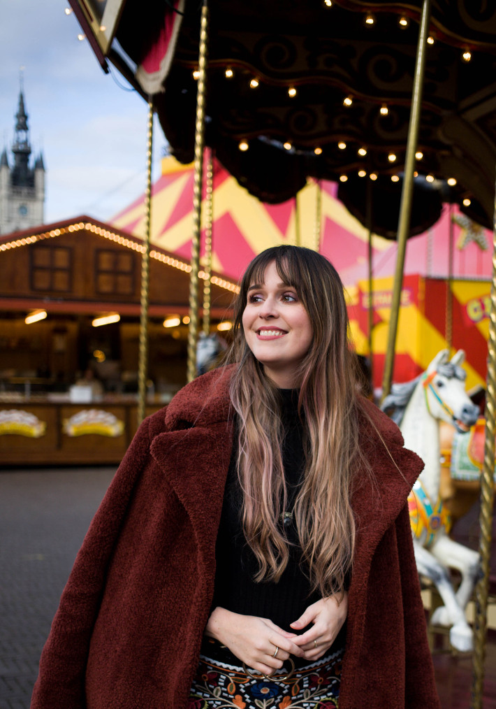 rust coloured teddy coat, embroidered skirt,