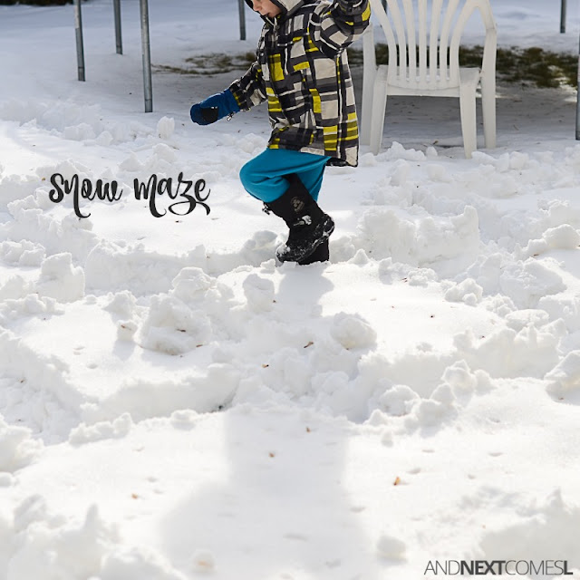 Child walking through a snow maze