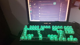 laptop with illuminated keys in a steno pattern