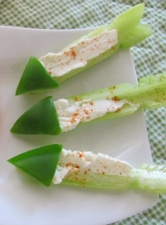 Cut up celery and green peppers into arrows