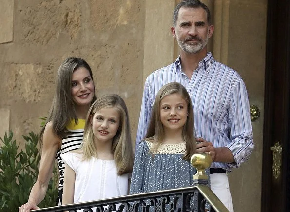 King Felipe, Queen Letizia and their daugthers Princess Leonor and Infanta Sofía on holiday in Palma de Mallorca. Letizia wore line blouse, style
