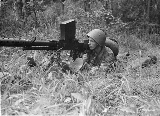 Finnish soldier looks down the sights of a 20mm Lahti L-39 anti-tank rifle, 2 August 1941 worldwartwo.filiminspector.com