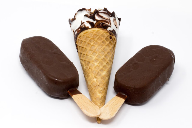 mini chocolate sticks and a cone on a white background