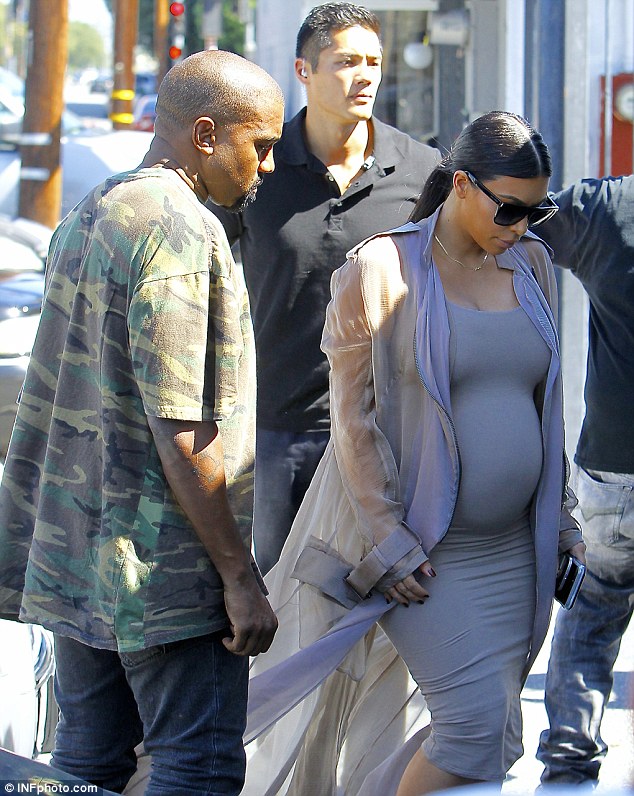 Kim Kardashian Puts Seven Month Pregnant Belly on Display in Nude Dress
