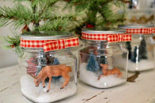 small glass jars with snow scene deer, trees, and deer. www.homeroad.net