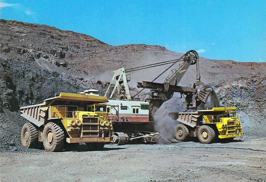 transpress nz loading mammoth dump trucks at an open cast mine in