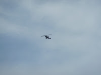 Military Helicopter with guns visible seen at moerenuma Park (Moerenuma Koen), Sapporo