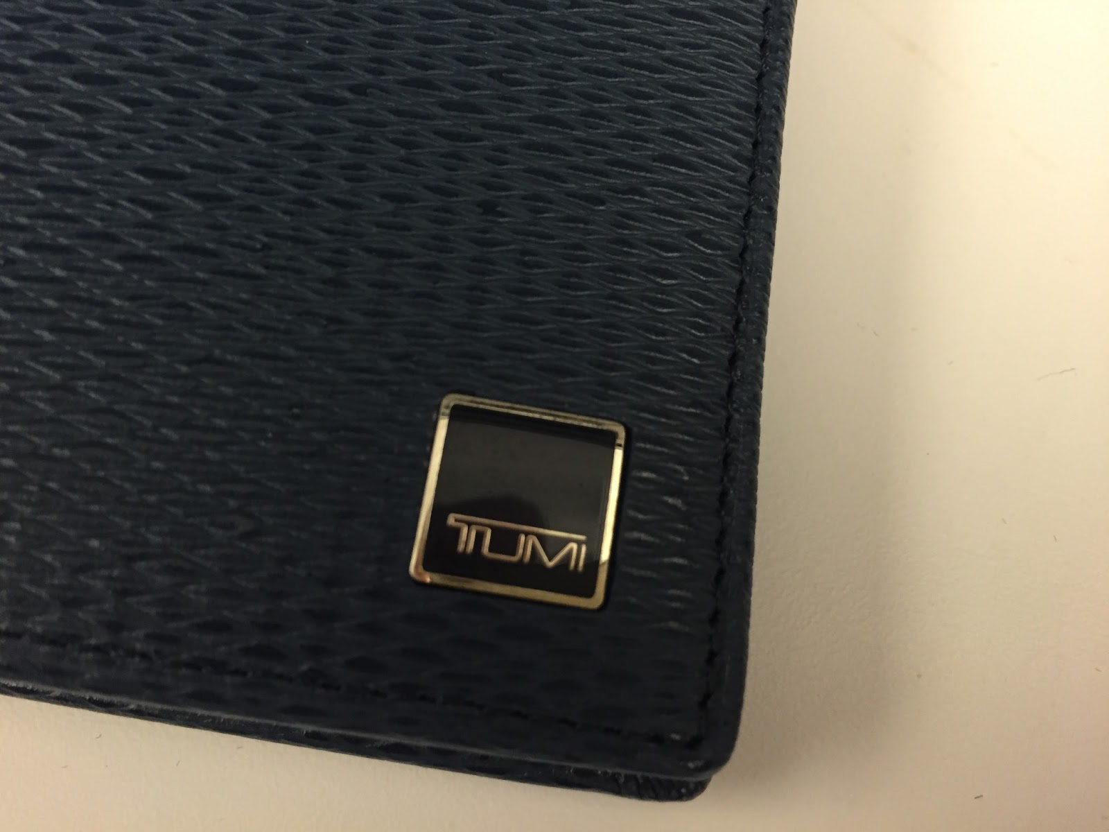 A New "Tumi" Wallet At Home with John Newman