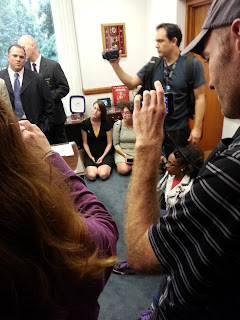 This is a photo of demonstrators who were protesting voter suppression legislation in the office of N.C. House Speaker Thom Tillis.