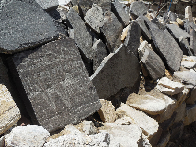 Stones with prayer symbols etched in them