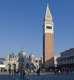 The campanile of St Mark's is a famous landmark in Venice, towering over the basilica