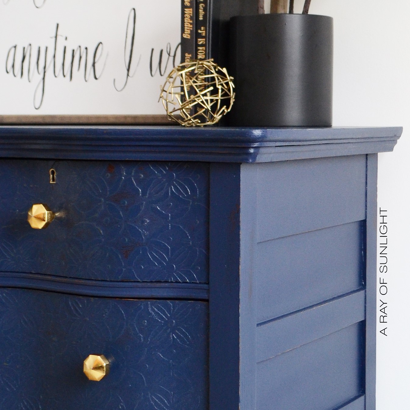 The Navy Dresser With Textured Drawers A Ray Of Sunlight Navy Blue Antique Serpentine Dresser With Embossed Drawers And Gold Geometric S Painted In Country