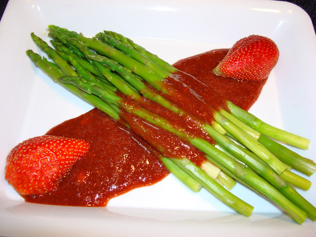 PORTIONS 4 INGREDIENTS 1 lb. asparagus, snap off the hard end of the spear. ½ cup balsamic vinegar, in a pot with a low flame reduce to 1/4 cup 6 very large strawberries 1/8 tsp. salt 1/4 tsp. ground black pepper PREPARATION In a pot with boiling water, cook asparagus until are cooked al dente. Cool it with tunning cold water, to keep a nice green bright color. In a blender pure strawberries, combine with the balsamic vinegar, salt and pepper. Serve asparagus in a platter and pour sauce on. NUTRITION FACTS PER SERVING Calories                        50.5        Monounsaturated Fat      0.0 g         Carbohydrate     11.1 g Total fat                          0.4 g     Cholesterol                      0.0 mg      Dietary Fiber       3.3 g Saturated Fat                  0.1 g     Sodium                         155.6 mg      Sugars                 2.1 g Polyunsaturated Fat       0.2 g      Potassium                     378.1 mg      Protein                2.8 g