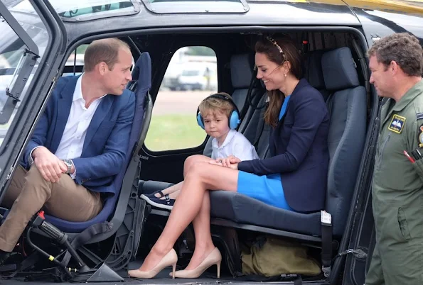 Prince William, Kate Middleton and Prince George visit the Royal International Air Tattoo at RAF Fairford. Kate wore Stella McCartney dress