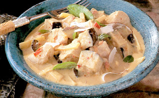 Classic Thai red chicken curry served in a bowl.