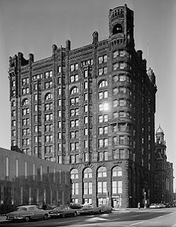 The Metropolitcan Building in 1960, 12 stories of dark stone and castle-like towers