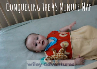 Text: Conquering the 45 Minute Nape  Picture: baby awake and looking up in crib with giraffe pacifier toy