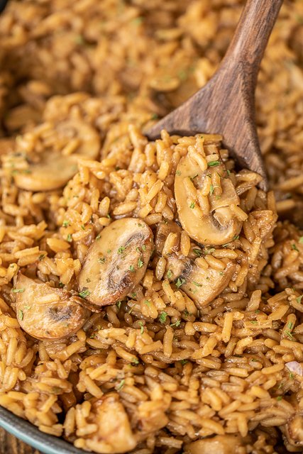 Au Jus Mushroom Rice - seriously delicious! Rice slow cooked in butter, onion, oregano, salt, pepper, beef broth, au jus gravy mix and mushrooms. I could make a meal out of this delicious rice!!! Ready to eat in under 30 minutes! Add some leftover steak, ground beef or pork for a quick main dish. #rice #beef #mushrooms Au Jus Mushroom Rice - seriously delicious! Rice slow cooked in butter, onion, oregano, salt, pepper, beef broth, au jus gravy mix and mushrooms. I could make a meal out of this delicious rice!!! Ready to eat in under 30 minutes! Add some leftover steak, ground beef or pork for a quick main dish. #rice #beef #mushrooms