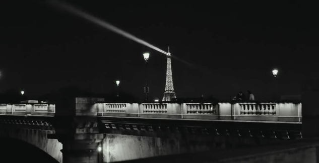 …to reveal the Eiffel Tower, which only the camera sees, was looming ...