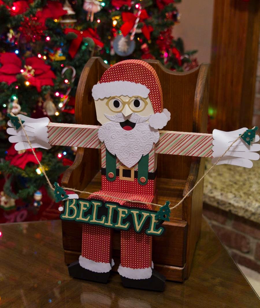 paper "wooden block" Santa sitting by the Christmas tree