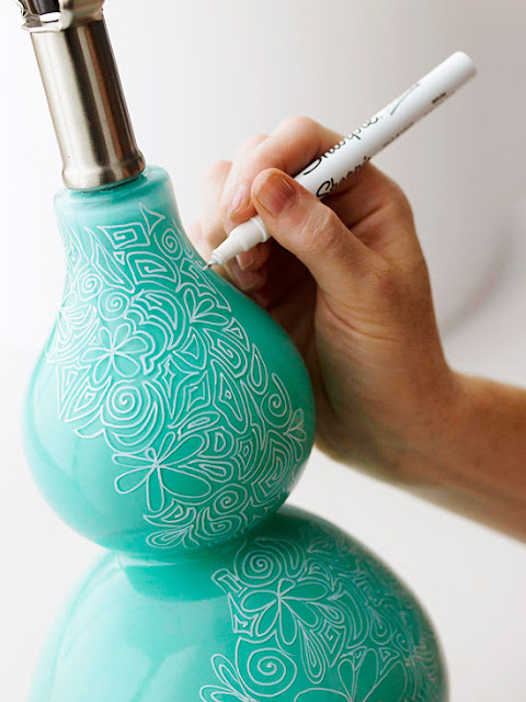 sharpie doodles on blue lamp base 