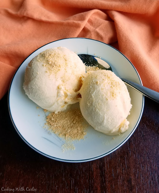 Super creamy homemade orange creamsicle cheesecake ice cream is going to be a new summer favorite dessert. It is cold, refreshing and has the perfect combination of orange and vanilla with a cream cheese twist! creamy orange flavored ice cream served