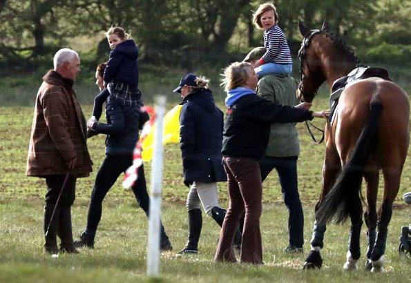 Princess Charlotte. Prince George wore Columbia fleece jacket, Kate Middleton wore Barbour longshore quilted jacket