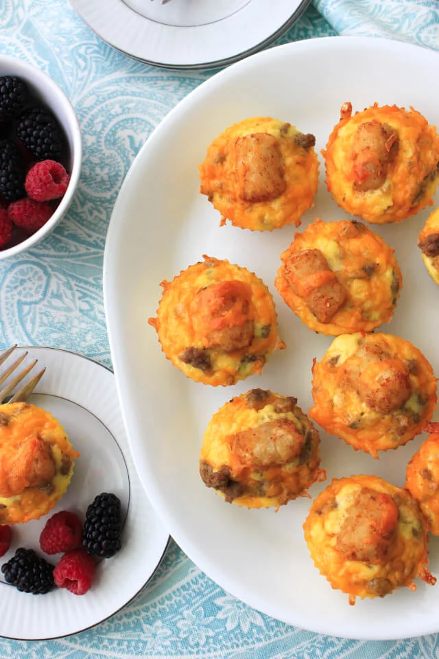 Cheesy Sausage and Tater Tot Breakfast Muffins combine maple turkey sausage, tater tots, eggs, and cheddar cheese in an easy to make muffin cup that can be made ahead and reheated on busy mornings! #ad #BackToButterball