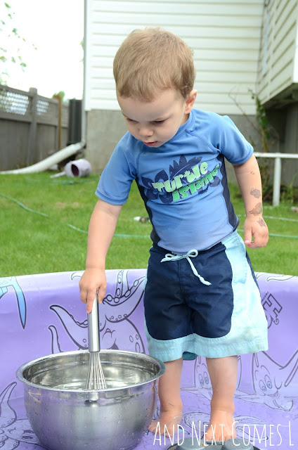 Child banging metal bowls as part of a musical science pool activity for kids